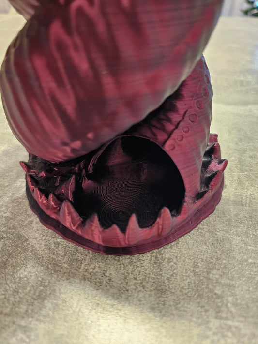 Twisting "worm" dice tower