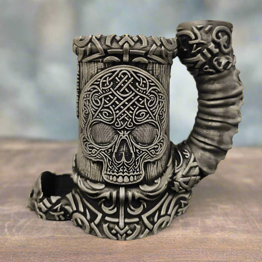 Side view of a brushed silver celtic dice tower mug