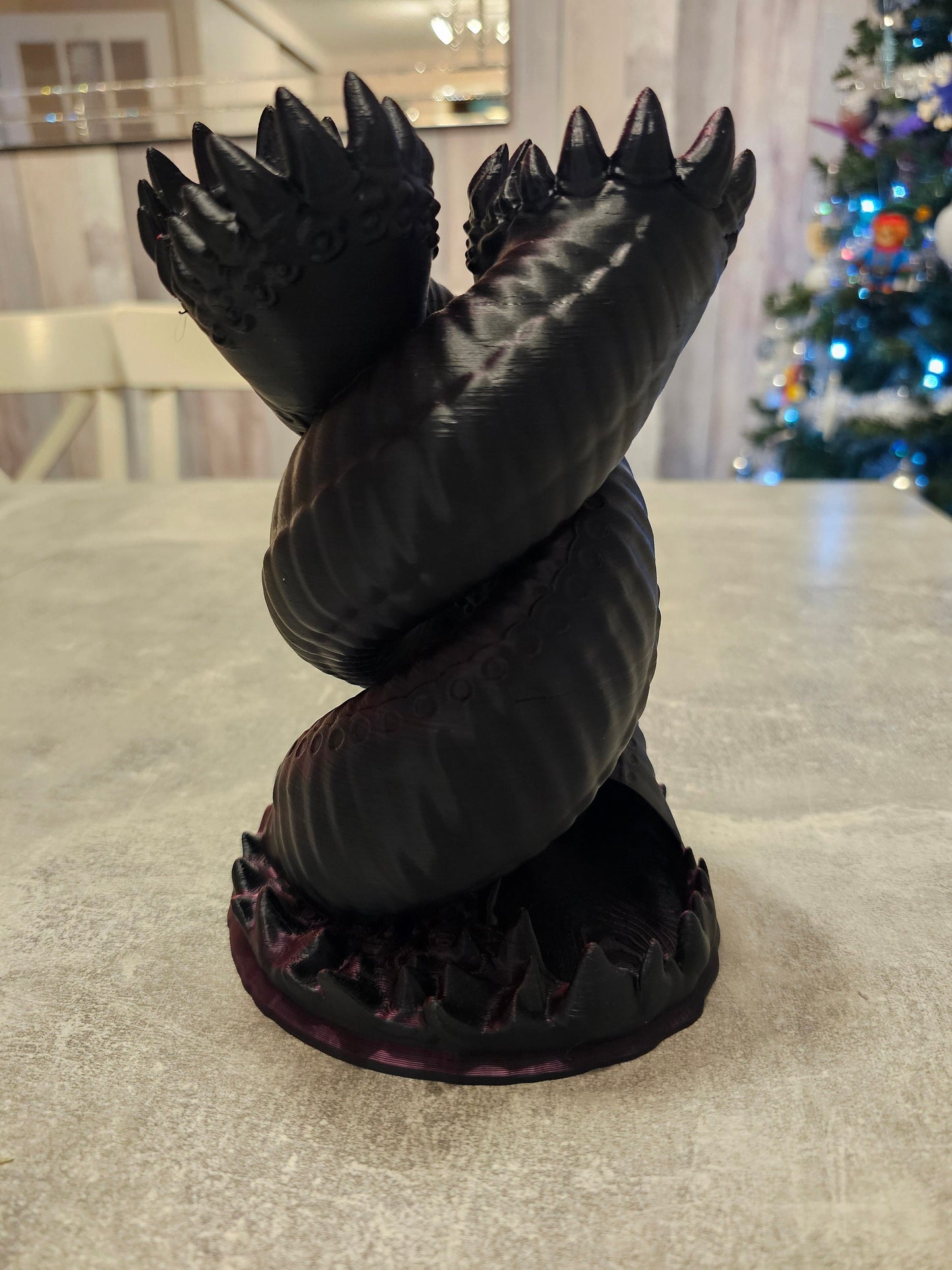 Twisting "worm" dice tower